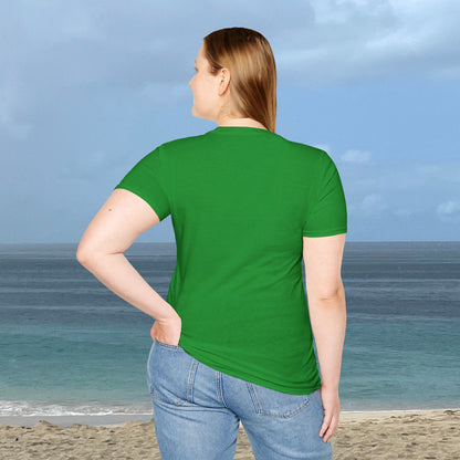 Back view of a woman wearing a plain green Coconut Tree T-shirt, standing by the ocean.