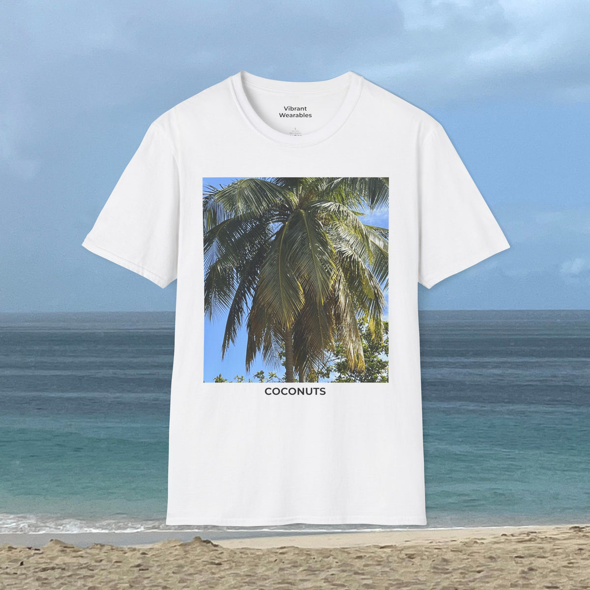 Front view of a white Coconut Tree T-shirt with a coconut palm photograph and “COCONUTS” printed beneath the image.